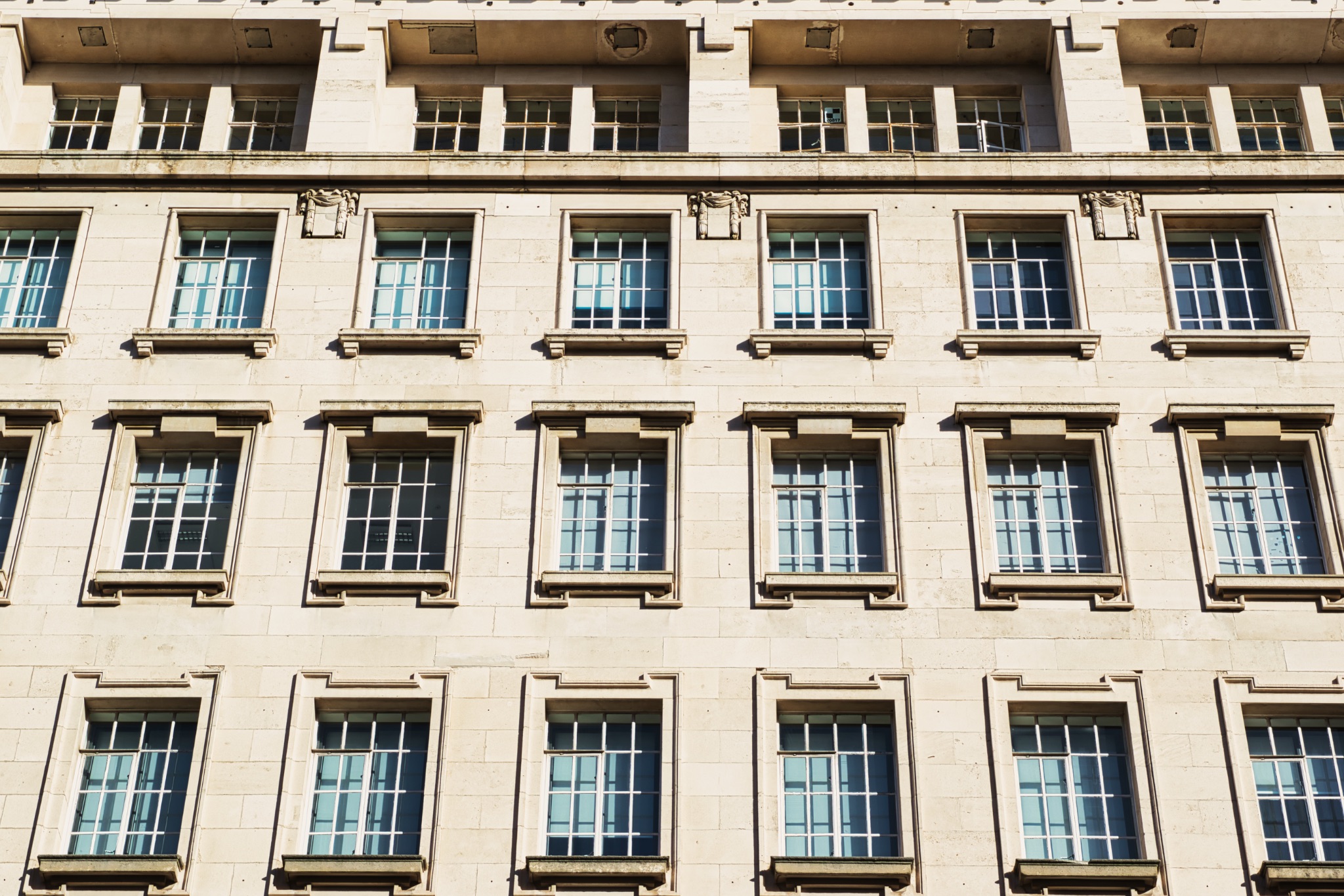 Building Facade with Grid of Windows in Manchester, UK.